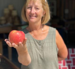 Karen Ferri holding an apple