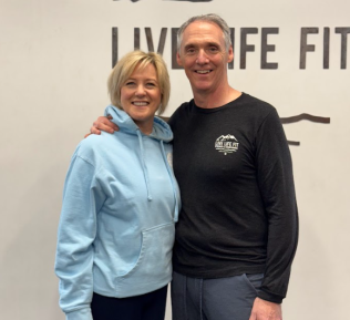Live Life Fit Owners standing in front of their logo