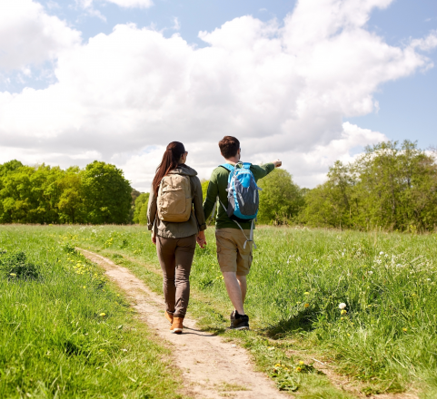 Couple hiking on a trail in spring