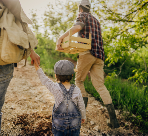 Family walking in field