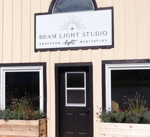 Beam Light Studio Entrance. A door and two windows with the beam light sign above them